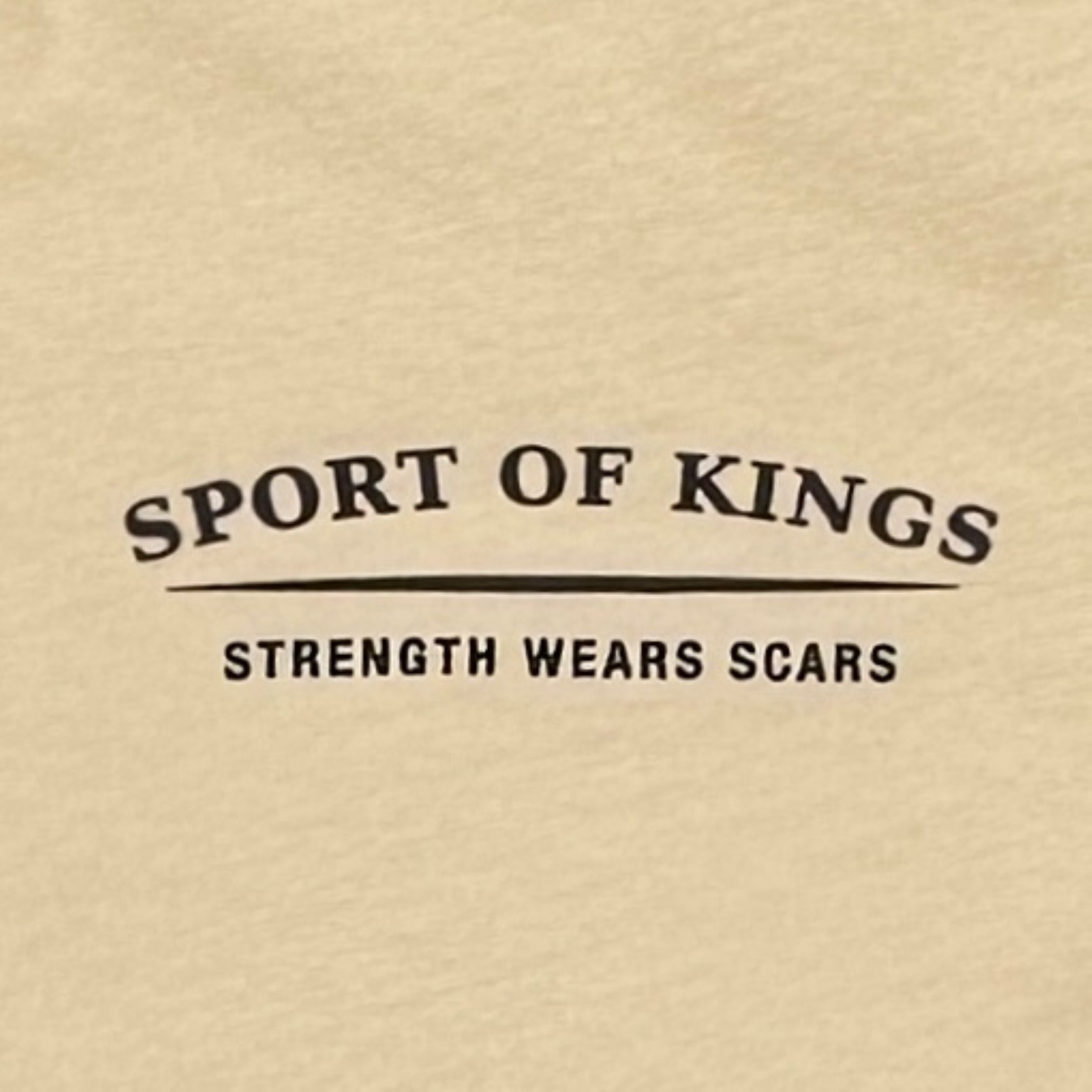 Strength Wears Scars Tee