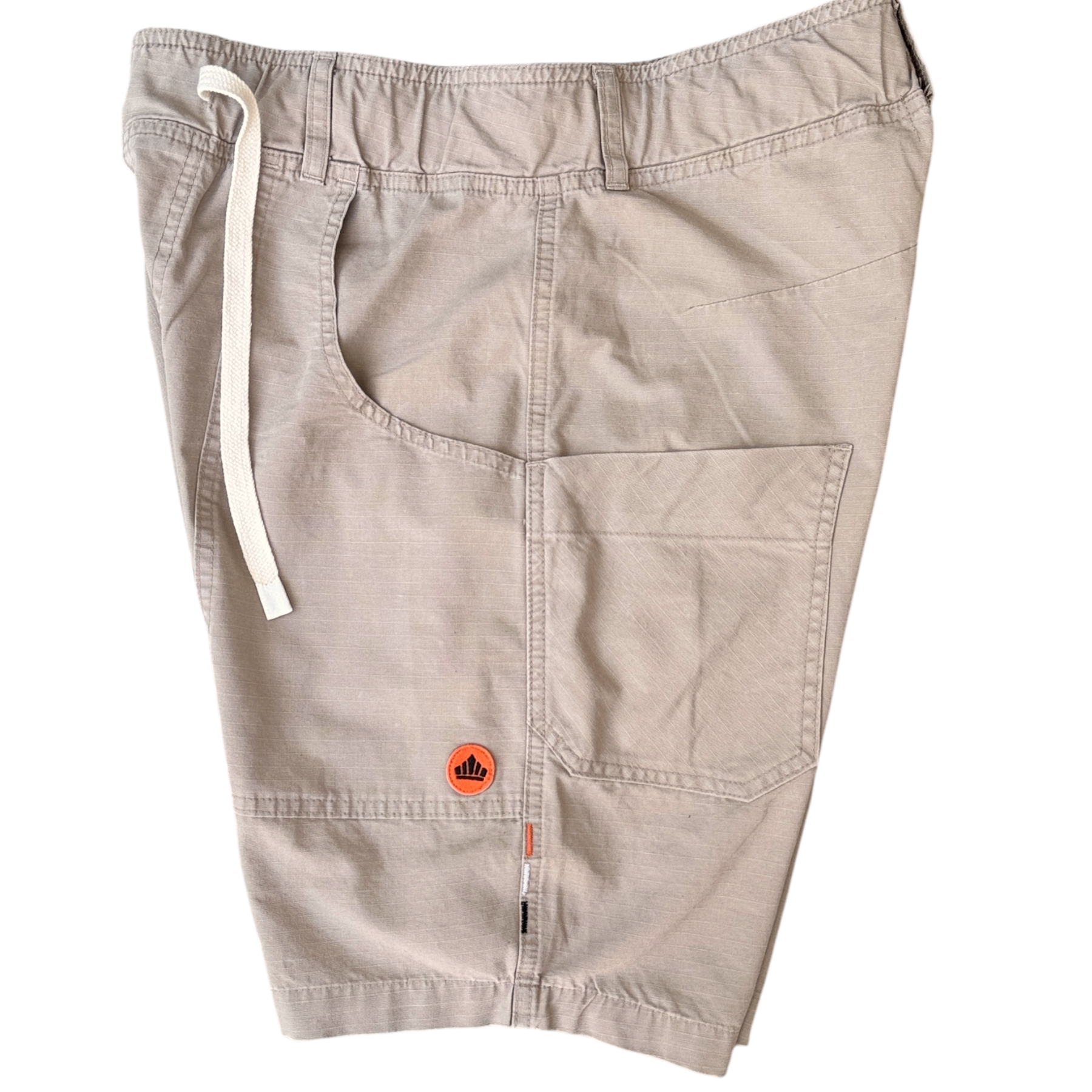 Beige shorts with a brand logo on a white background